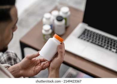 A Man Feeling Unwell And Taking Pills