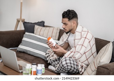 A Man Feeling Unwell And Taking Pills