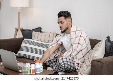 A Man Feeling Unwell And Taking Pills