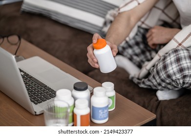 A Man Feeling Unwell And Taking Pills