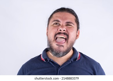 A Man Feels A Mouth Ulcer Near His Lower Lip With His Tongue. Probing The Canker Sore While Feeling Pain And Discomfort.