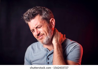 Man feels neck pain. People, healthcare and medicine concept