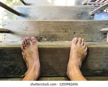 Man Feet Standing On Wooden Stairs, Vintage Style.