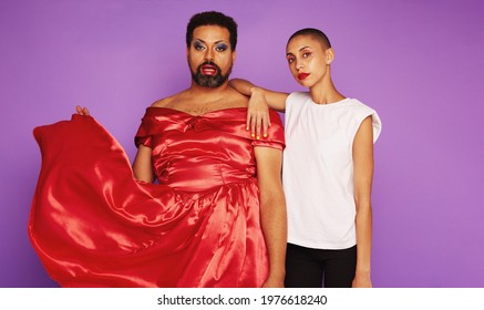 Man In Female Clothing And Woman In Male Clothing. Models Breaking The Gender Stereotypes