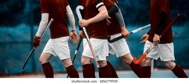 Man field hockey team before start of the game discussing strategy. Team sport concept. Vintage color filter - Powered by Shutterstock