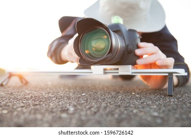 man filming with using slider