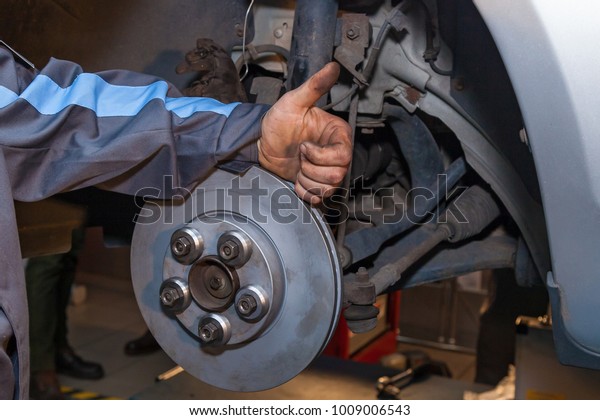 The man finished repairing the disc brake. Disc\
Brake Repair.