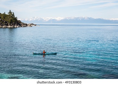 Man Fishing From Kayak At Lake Tahoe