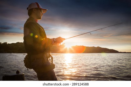 Man Fishing On A Lake
