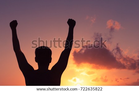 Man with fist in the air celebrating victory. . 