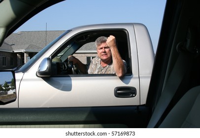 Man With Fist In The Air Showing Symptoms Of Road Rage