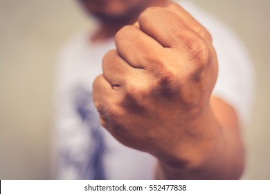 A Man Fists Clenched In Anger