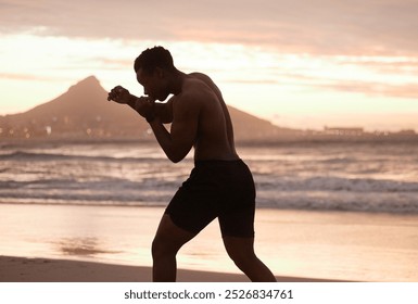 Man, fitness and boxing with silhouette at beach for workout technique, exercise and wellness. Male athlete, topless and boxer with punch by ocean water for sunset, training and sports challenge - Powered by Shutterstock