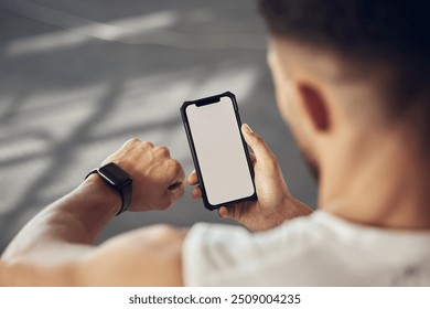 Man, fitness and checking with phone screen or smartwatch for tracking, performance or progress at gym. Male person with wristwatch and smartphone for training app, sync or health tracker on mockup - Powered by Shutterstock