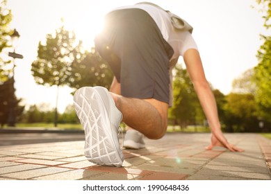 Man In Fitness Clothes Ready For Running Outdoors, Low Angle View