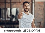 Man, fitness and portrait in gym with thumbs up, smile and satisfaction for training. Happy, hand gesture and personal trainer in wellness center for thank you, support and good feedback for exercise