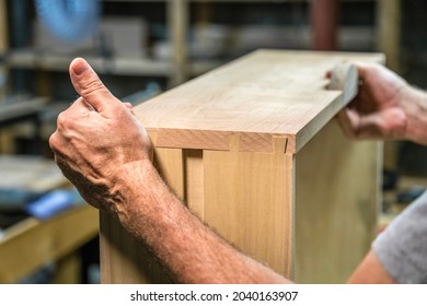 Man Fitting Dovetails While Woodworking.