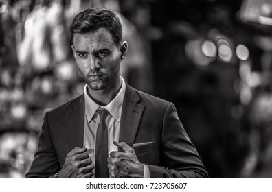 Man Fitting A Suit In Dark Bangkok Alley