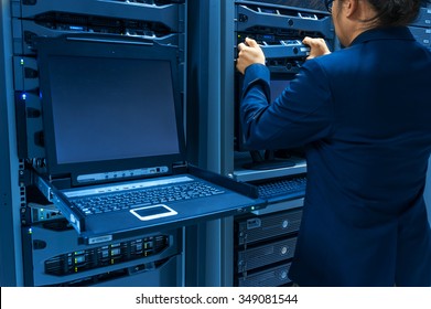 Man Fix Server Network In Data Center Room .