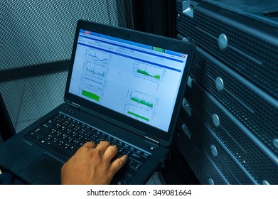 Man fix server network in data center room . - Shutterstock ID 349081664