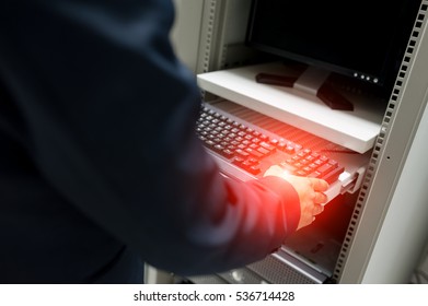 Man fix server network in data center room .