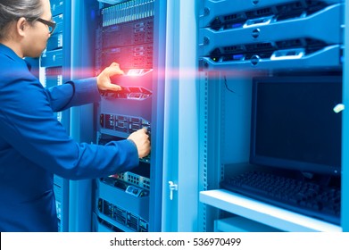 Man Fix Server Network In Data Center Room