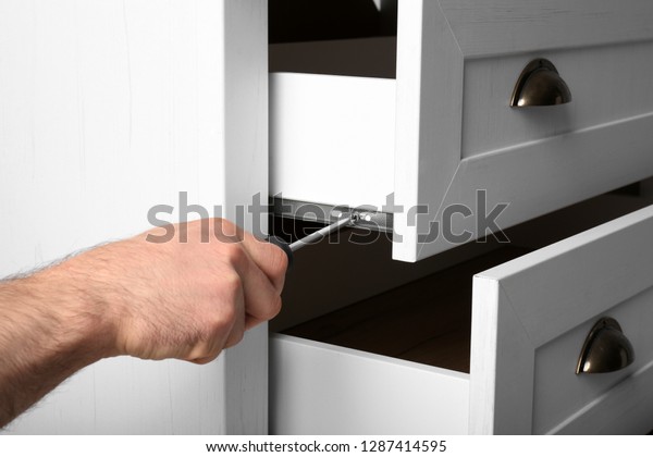 Man Fixing Drawer White Wardrobe Screwdriver Stock Photo Edit Now