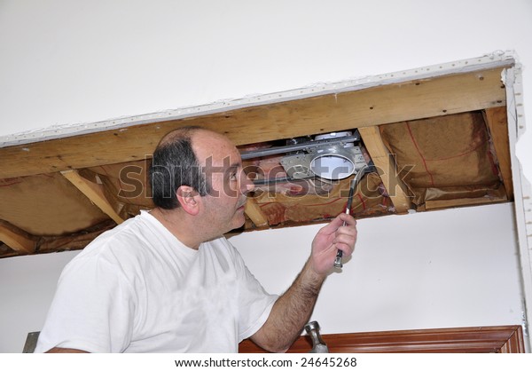 Man Fixing Interior Electrical Ceiling Light Stock Photo Edit Now