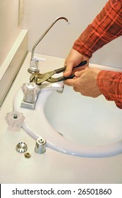 Man Fixing Leaky Faucet