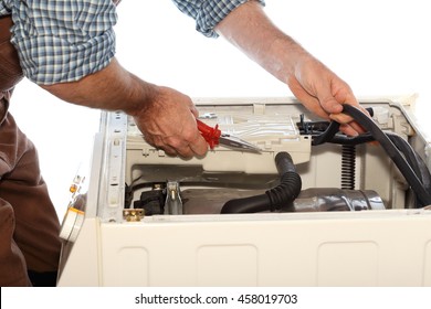 Man Is Fixing A Problem On A Clothes Washer