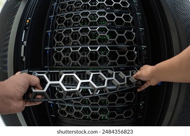 Man fixing server in data center room .                