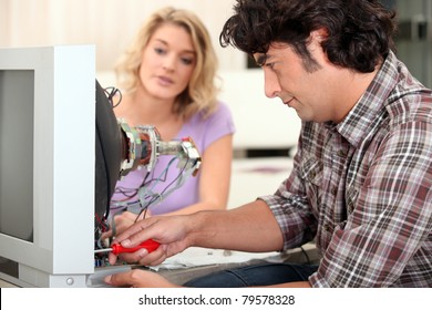 Man Fixing Television