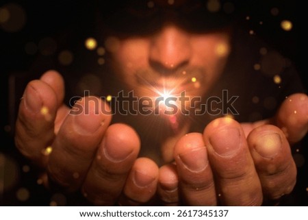 man with a flash of magic light in his hands