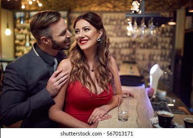 
Man Flirt To Beautiful Woman Inside At Evening