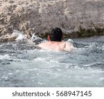 a man floating in the river