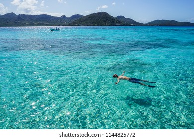 Man Floating In The Sea Of Providence Island (Isla De Providencia), Colombia