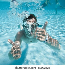 Man Floats Underwater In Pool