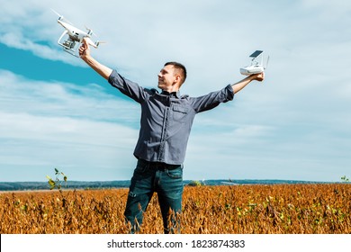 Man Flying A Drone In The Yellow Field 