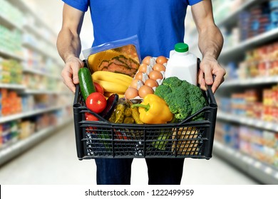 Man With Food Box In Hands At Grocery Store