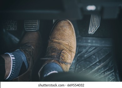 Man Foot Press The Break  Pedal Of A Car.