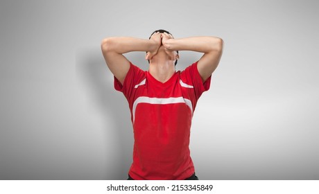 A Man A Football Fan In A Club T-shirt Is Sad And Rejoices