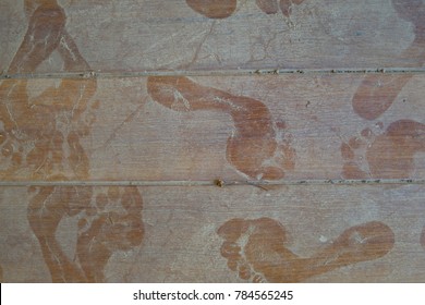 Man Footprint On Dusty Wood Floor