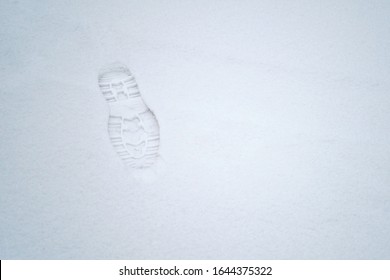 Man Footprint On White Winter Snow. Track In Snow. Flat Lay Overhead View. Snowy Road. Winter Footsteps Background, Copy Space