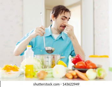 Man With Foul Food At Kitchen