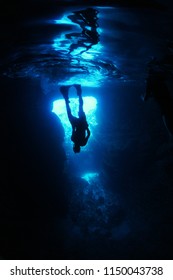 Man Free Diving In Cave