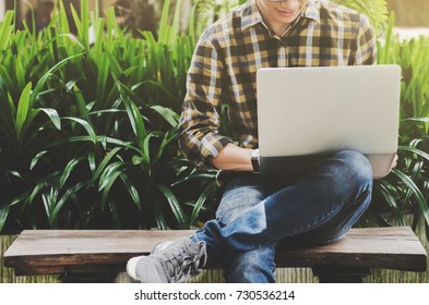 man freelance / college student using laptop at a outdoor - Shutterstock ID 730536214
