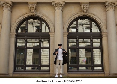 Man in front of building