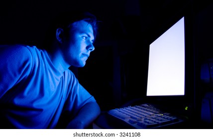 Man In Front Of Computer. Dark Night Room.