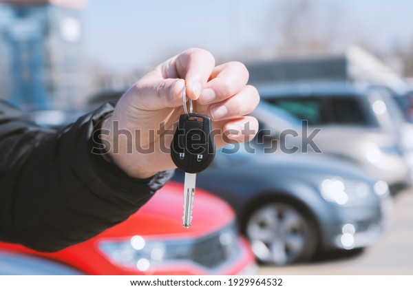 Man in front of the new car and holding keys,\
High quality 4k footage