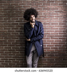 Man in front of a wall